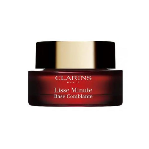 Clarins Instant Smooth Perfecting Touch 15ml, a silky primer in a sleek tube, designed to smooth and perfect skin texture.