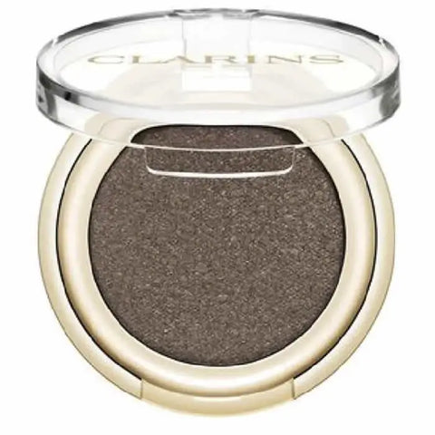Clarins Ombre Skin 06 Satin Mocha eyeshadow in a soft brown shade, displayed in a sleek compact with brand branding.