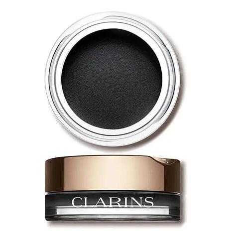 Close-up of Clarins Ombre Velvet 06 eyeshadow in black, showcasing smooth, velvety texture and sleek packaging.