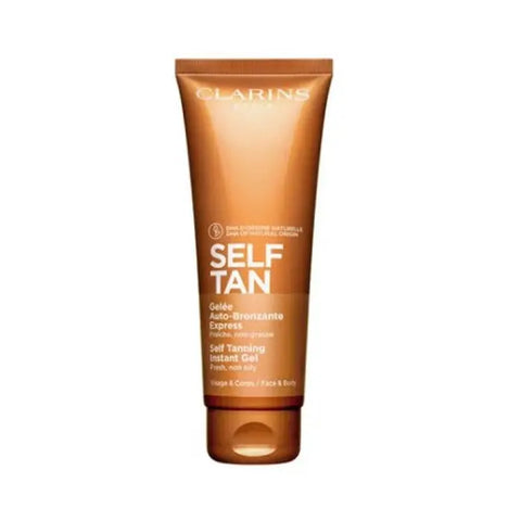 Clarins Self Tanning Instant Gel 125ml from Jag Couture London, showing a sleek tube of tanning gel with a pump dispenser.