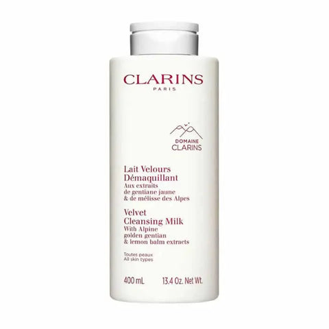 Clarins Velvet Cleansing Milk bottle with pump dispenser, 400ml, displayed with soft background and elegant packaging.