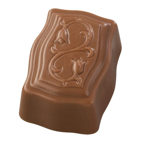 Milk praline with coconut by Jag Couture London, Cocoly 15.3g, showing a chocolate treat with coconut flakes.