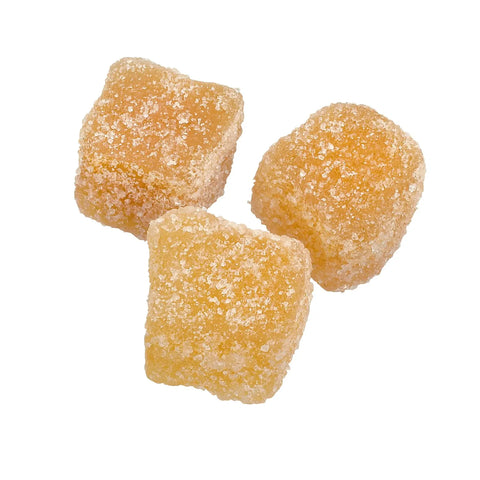 Crystallised stem ginger pieces from Jag Couture London New York, showing golden, sugared ginger slices in close-up.