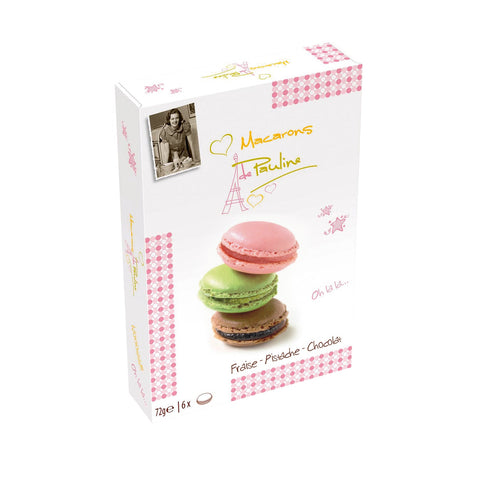 Six colorful macarons in a gift box including pistachio, chocolate, and strawberry flavors by Jag Couture London New York.