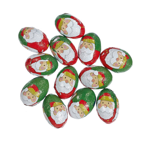 Solid milk chocolate balls shaped like Santa Claus, wrapped in festive foil, by Jag Couture London - New York.