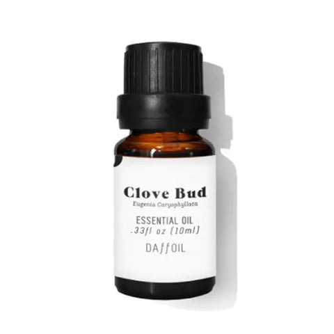Daffoil Clove Bud Essential Oil in 100ml bottle by Jag Couture London - New York, showing the essential oil bottle with clove buds.