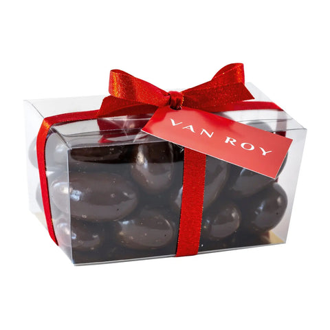 Dark chocolate Brazil nuts in a cello ballotin with ribbon, presented by Jag Couture London New York, elegant gift packaging.