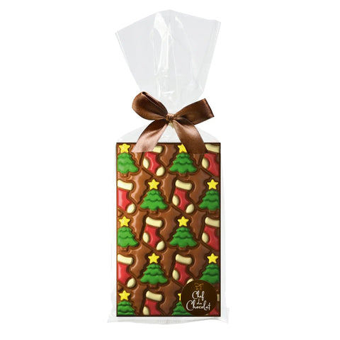 Decorated milk chocolate bar with tree and stocking design in clear cello bag by Jag Couture London New York.