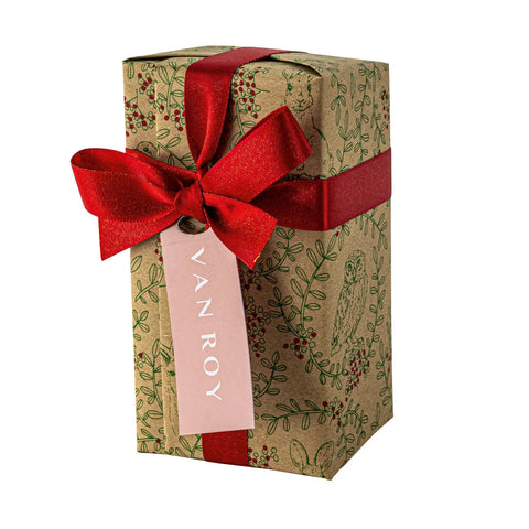 Deluxe Christmas ballotin of Belgian dark chocolates from Jag Couture London New York with a menu tag, wrapped in festive packaging.