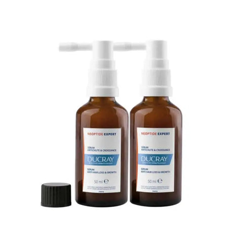 Ducray Neoptide Expert Serum for hair loss and growth, 2x50ml bottles, featuring a sleek white and blue packaging.