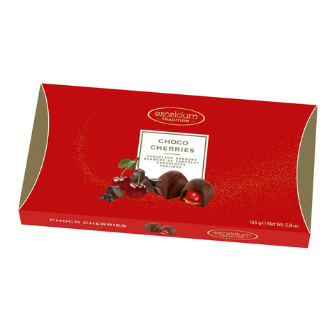 Dark chocolate pralines with cherry filling from Excelcium Choco Cherries by Jag Couture London New York, displayed on a white surface.