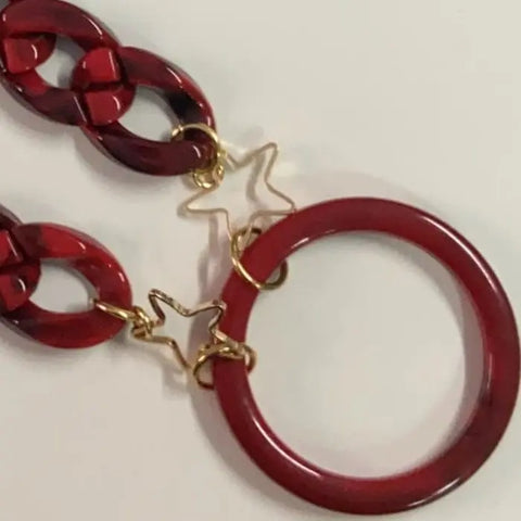 Jag Couture London-New York Farmamoda garnet necklace for glasses, featuring a stylish jewelry accessory with garnet stones.