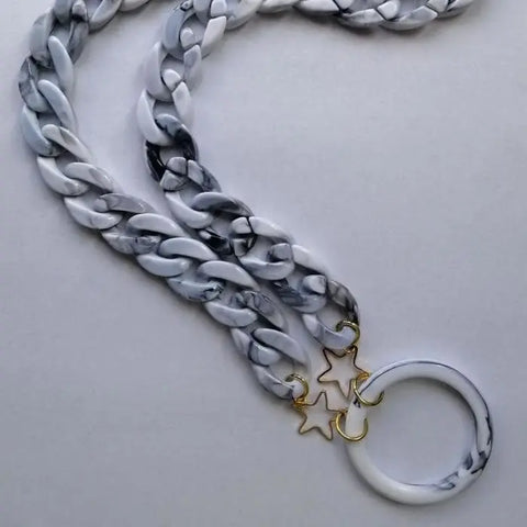 Gray marble sunglasses necklace by Jag Couture London New York, featuring a stylish pendant with sleek marble design.