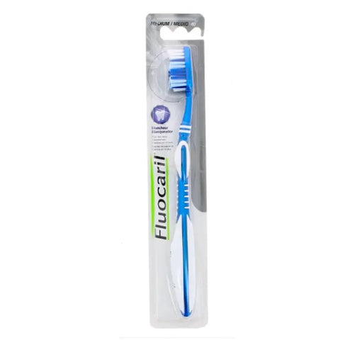 Jag Couture London New York Fluocaril toothbrush with whitening bristles, medium firmness, designed for effective dental cleaning.