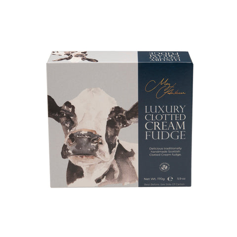 Carton of Meg Hawkins Friesian Cow clotted cream fudge by Jag Couture London New York, featuring detailed packaging with a Friesian cow illustration.