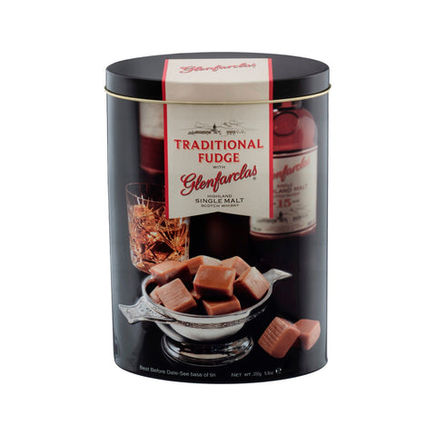 Glenfarclas malt whisky flavored fudge in a decorative tin, featuring rich caramel and whisky-infused pieces by Jag Couture London.
