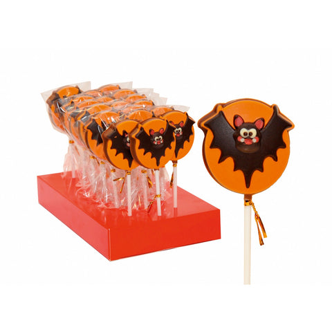 Hand-decorated solid milk chocolate bat lolly by Jag Couture London New York, featuring detailed chocolate decoration on a stick.