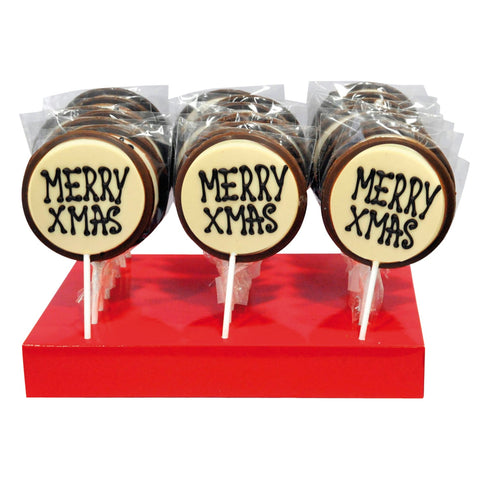 Hand-decorated milk chocolate Merry Xmas lollies by Jag Couture London-New York on a festive display.