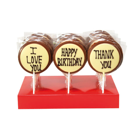 Hand decorated milk chocolate message lollies with "Thank You," "Happy Birthday," and "I Love You" from Jag Couture London - New York.
