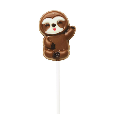 Hand-decorated chocolate sloth lollipops displayed on a tray, crafted by Jag Couture London - New York.