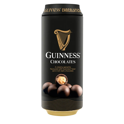 Guinness beer can with dark chocolate balls filled with Guinness-flavored ganache, displayed in a decorative arrangement.