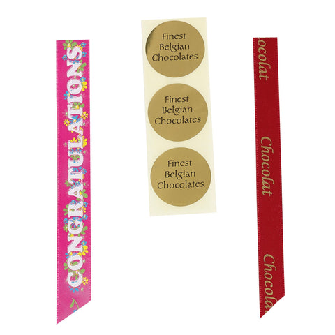 Assorted Belgian chocolate stickers from Jag Couture London - New York, featuring glossy, decorative chocolate designs on a white background.