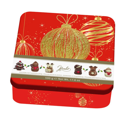 Hamlet festive tins by Jag Couture London with hazelnut praline-filled Christmas figures in three colors.