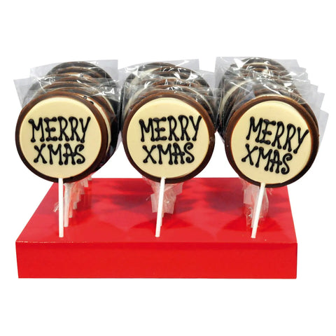 Hand-decorated milk chocolate Merry Xmas lollies by Jag Couture London New York, featuring festive holiday designs.