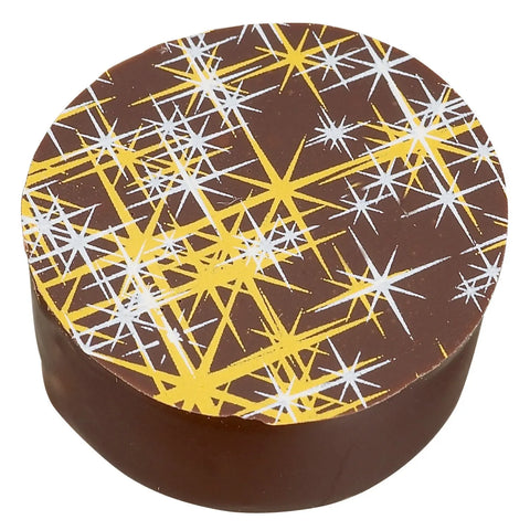 Dark chocolate filled with whisky, lemon, and cinnamon from Jag Couture London New York, showcasing a Hot Toddy-inspired treat.