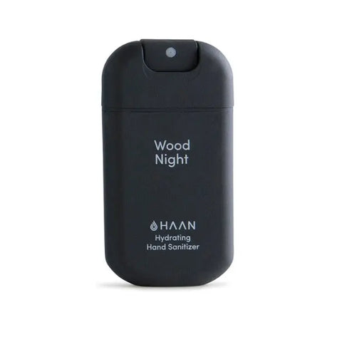 Hydrating hand sanitizer in a 30ml Wood Night scent bottle by Jag Couture London New York, with a sleek, modern design.