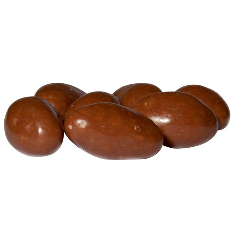 Milk chocolate covered Brazil nuts from Jag Couture London - New York, showing glossy chocolate coating and whole nuts inside.