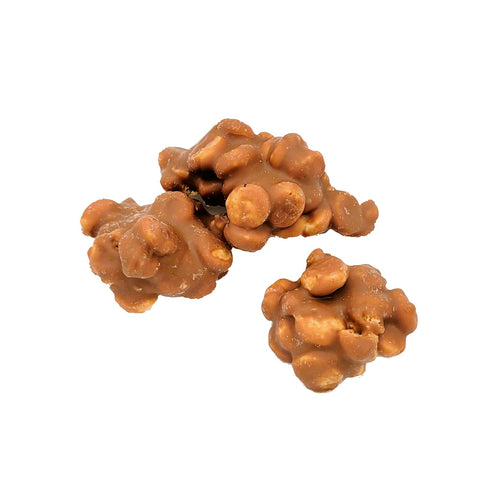 Milk chocolate covered cookie and fudge clusters by Jag Couture London - New York, featuring crunchy cookies and smooth fudge inside.