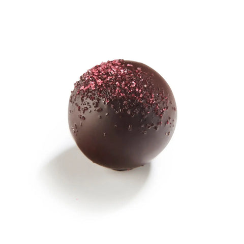 Dark chocolate Jill with raspberry-flavored ganache, 14g, from Jag Couture London New York, shown with a glossy finish and rich texture.