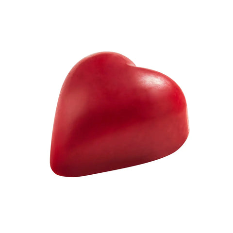 Julio red-colored white chocolate heart with praline from Jag Couture London; 14g, detailed close-up of the sweet confection.