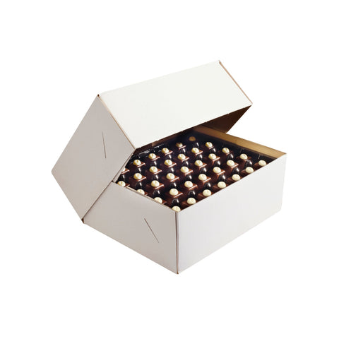 Jag Couture London - New York reduced sugar chocolate selection featuring milk, white, and dark chocolates on a display tray.