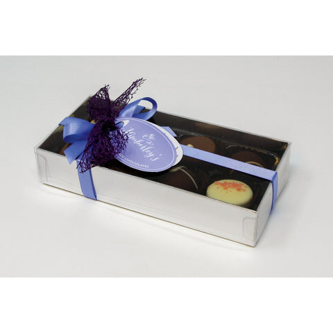 Eight handmade English truffles and chocolates in a silver gift box with a menu tag, by Jag Couture London – New York.