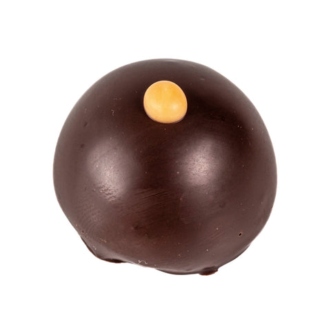 Dark chocolate praline filled with gin and rhubarb crème fraîche by Jag Couture London New York, 14g.
