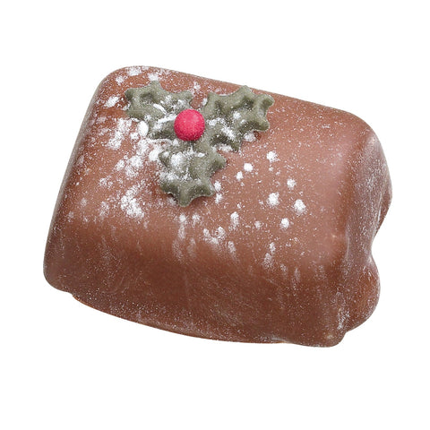 Milk chocolate Yule log by Jag Couture London New York filled with chocolate mousse, showcasing a smooth, creamy dessert.