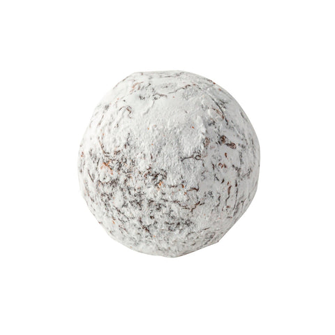 Swiss white chocolate Marc de Champagne truffle with cream ganache and icing sugar dusting, approximately 12.5g per piece.