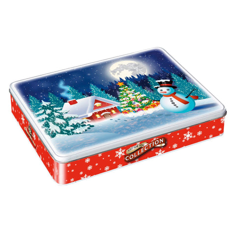 Assorted shortbread cookies in a festive Christmas scene tin by Jag Couture London New York, featuring holiday-themed shapes.