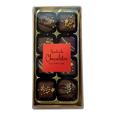 Linden Lady 8 chocolates in a gold box with a clear cello lid, packaged by Jag Couture London - New York.