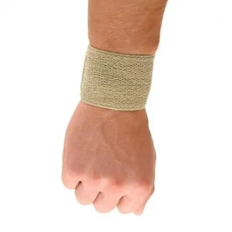 Beige small-sized Lástic-Bass wrist brace by Jag Couture London - New York, shown on a mannequin hand.
