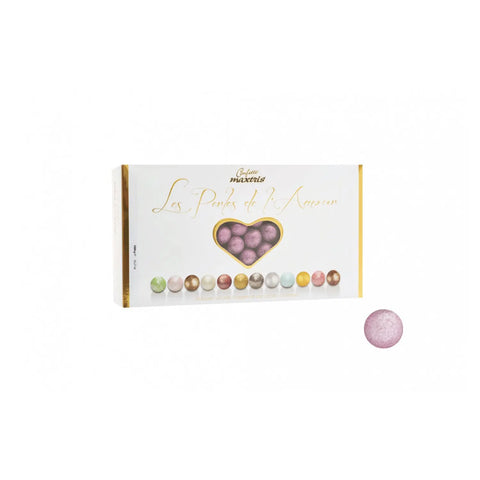 Les Perles Summer Rose chocolates by Jag Couture London featuring toasted hazelnuts in dark and white chocolate with pink sugar coating.