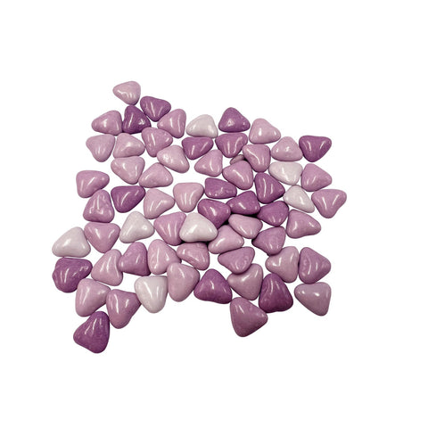 Milk chocolate hearts covered in purple sugar from Choco Love Lilla by Jag Couture London New York displayed on a white background.