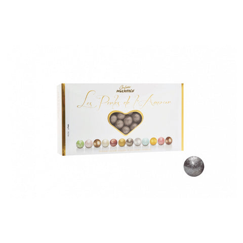 Jag Couture London Les Perles Winter Argent toasted hazelnuts in dark chocolate with silver sugar, elegant confectionery treat.