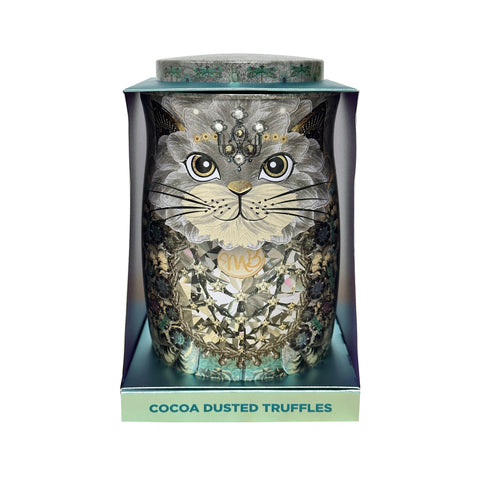 Assorted flavored cocoa dusted truffles in a decorative tin featuring a snow cat design by Jag Couture London - New York.