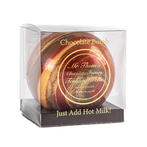 Mr Thoms milk chocolate gingerbread bomb in acetate gift box by Jag Couture London New York, showcasing a festive chocolate treat.