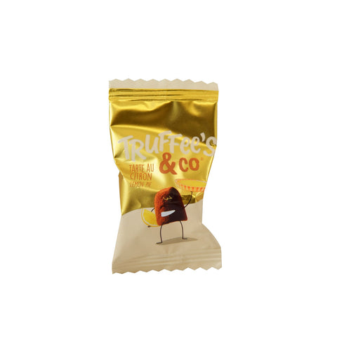 Cocoa dusted French lemon pie flavored truffles in yellow flow wrap by Jag Couture London - New York, approx 400 pieces.