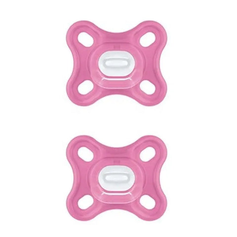 Two pink Mam Comfort silicone pacifiers with sterilizing box, designed for babies, by Jag Couture London - New York.