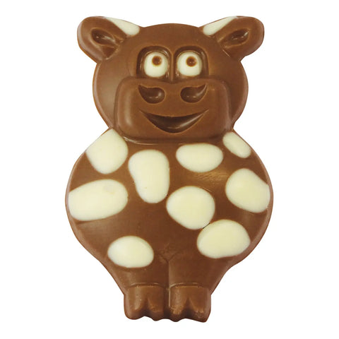 Decorated solid milk chocolate Matilda the cow figurines from Jag Couture London, approximately 35 pieces on display.